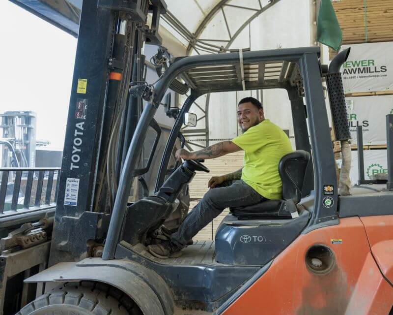 smiling-employee-forklift smiling employee forklift